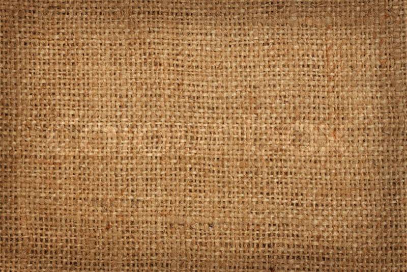 The background of coarse linen burlap in a cage, stock photo