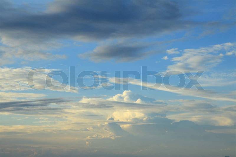Blue sky and white clouds with golden light sunset, stock photo