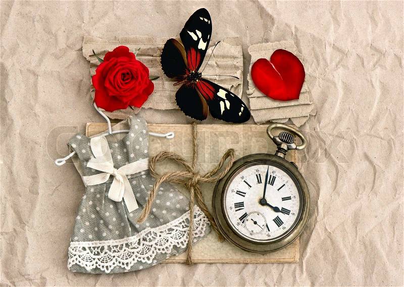 Old love post cards and vintage clock, red rose flower, valentine heart and butterfly. nostalgic romantik background, stock photo