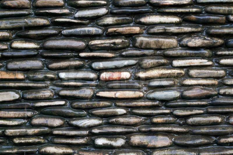 Wall of wet stones, stock photo