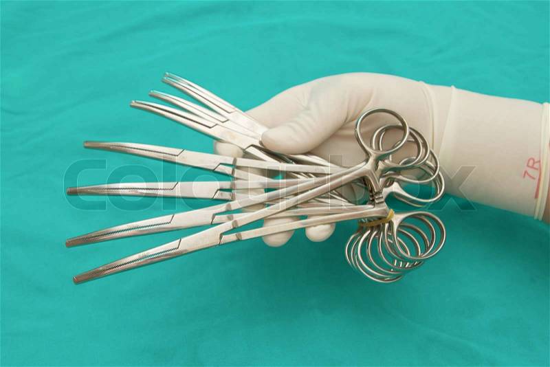 Doctor \'s hand halding The artery forceps & clamps,Surgical Instruments, stock photo