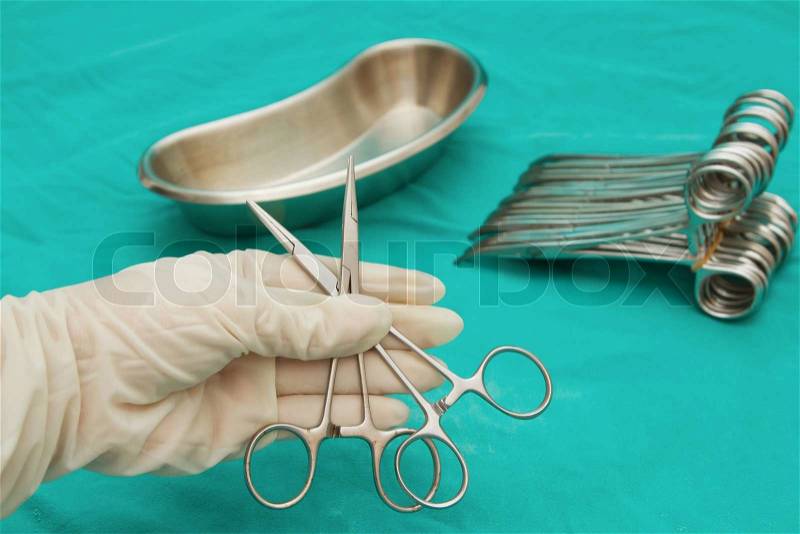 Doctor \'s hand holding The artery forceps & clamps,Surgical Instruments, stock photo