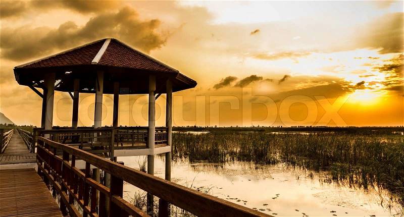 Boardwalk on the lake at sunset, Sam Roi Yod National Park, Prachuap Khiri Khan, Thailand , stock photo