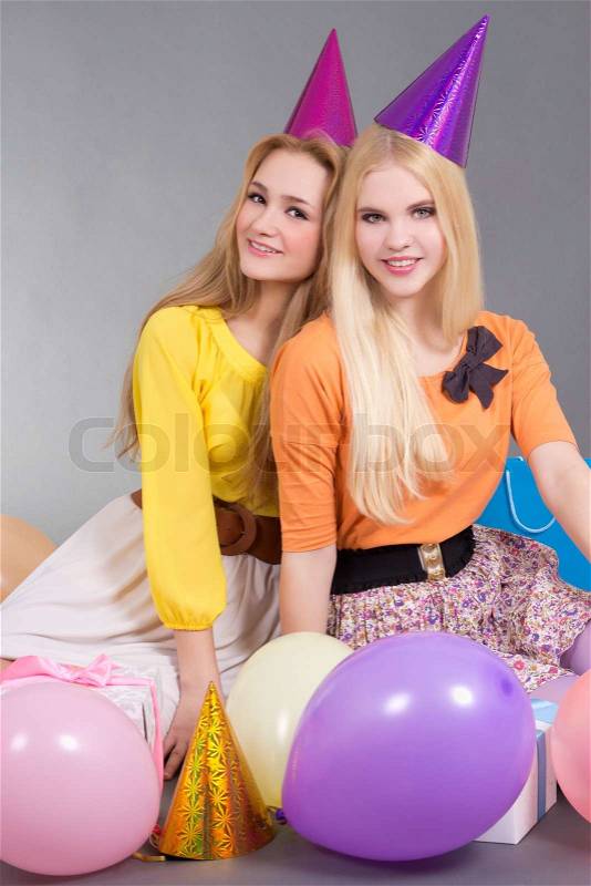 Teenage girls with balloons at a birthday party, stock photo