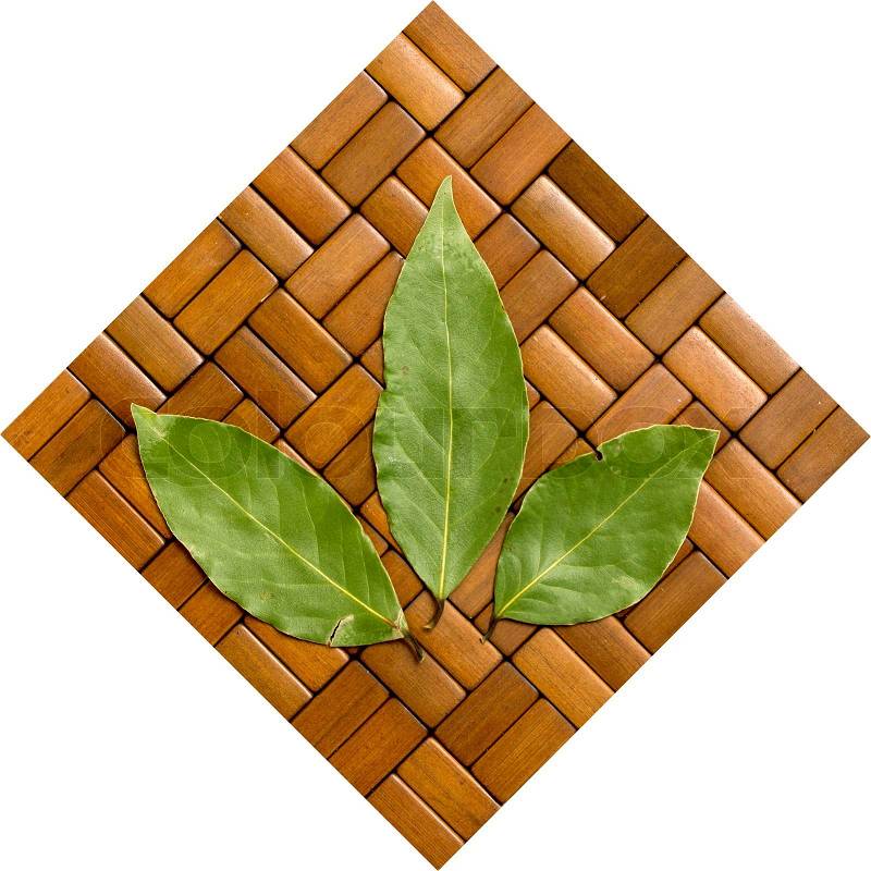 Green bay leaf on wooden background, stock photo