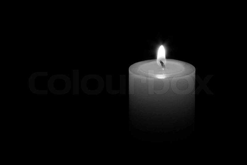 A candle isolated with black background, stock photo