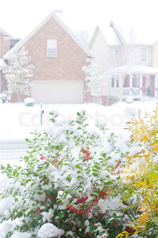 Snowfall on a street in an american town, view from front porch shallow dof, stock photo
