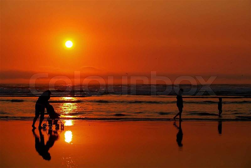 Sunset with people at the Beach on the Oregon Coast, stock photo