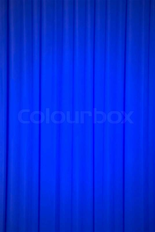Brightly lit blue curtains for background, stock photo