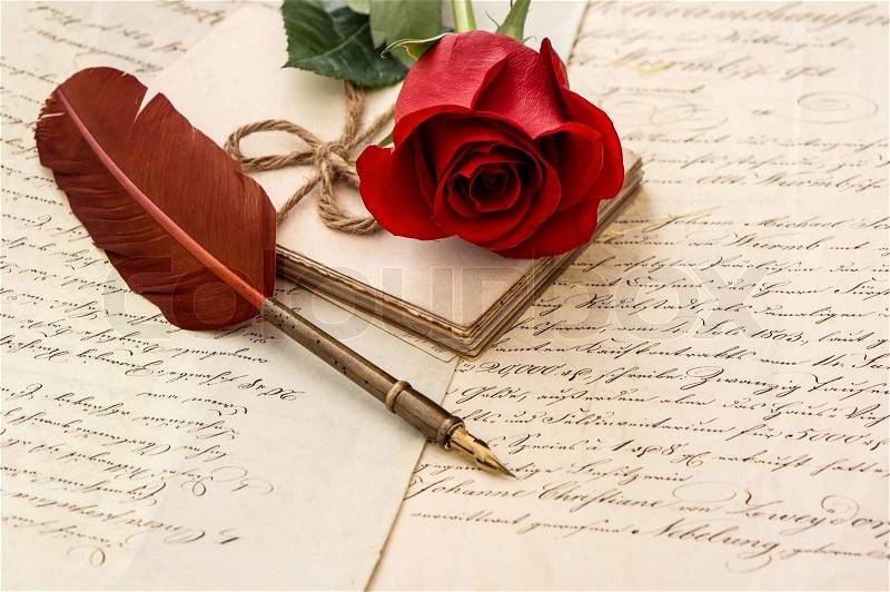 Old letters, rose flower and antique feather pen. romantic vintage background. selective focus, stock photo