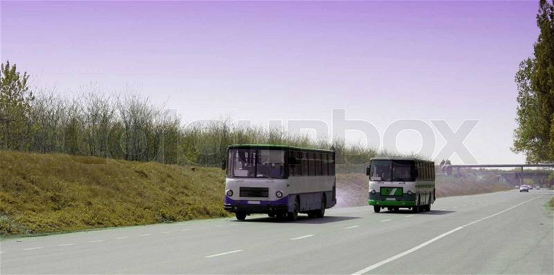 Two buses on the highway viewed from the front, stock photo
