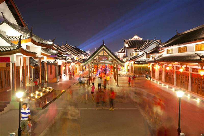 Crowd walking in chinese ancient town at night, stock photo