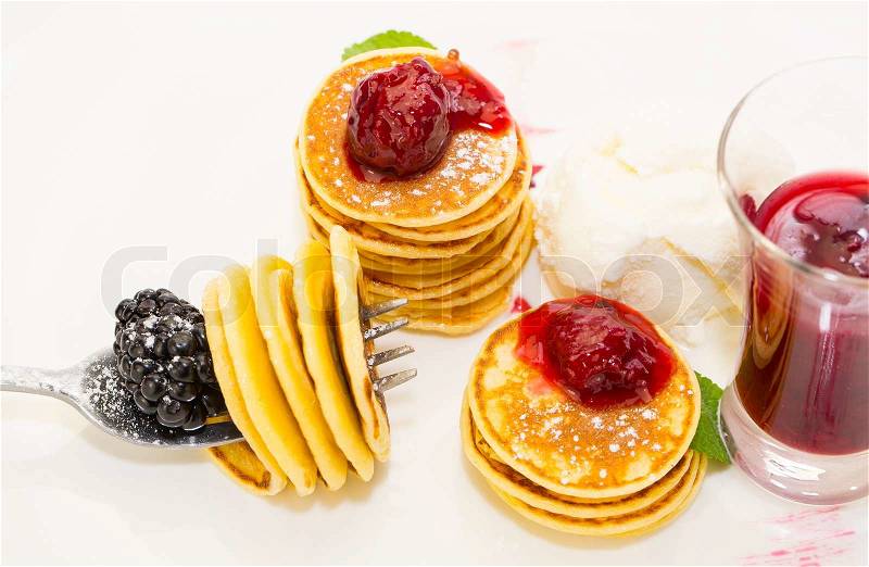 Sweet little pancakes with blackberry jam, stock photo