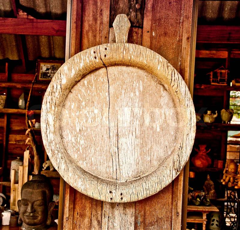 The Old wooden circle frame on wood pole background, stock photo