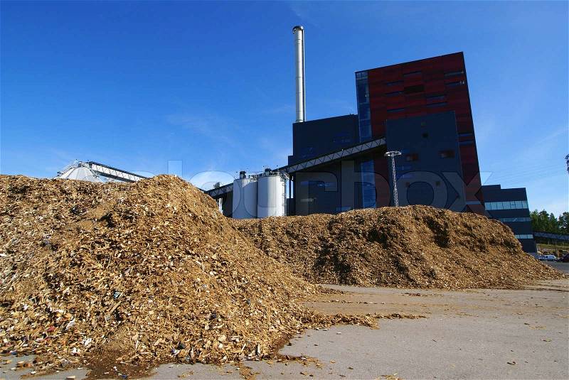 Bio power plant with storage of wooden fuel , stock photo