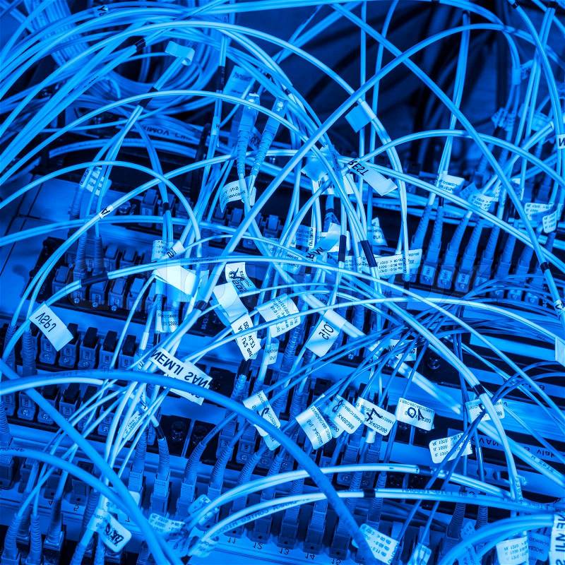Server with fiber optic cables in data center, stock photo