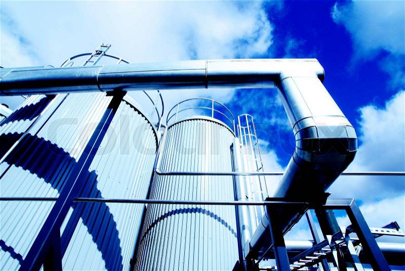 Modern industrial factory against blue sky, stock photo