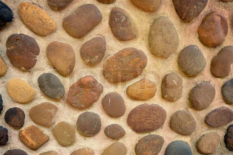 Abstract pebbles round textured wall, stock photo