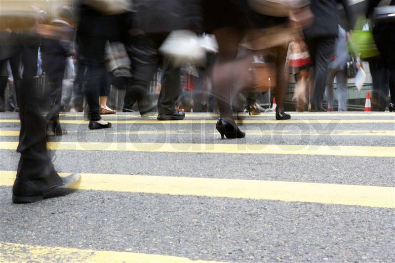 Close Up Of Commuters Feet Crossing Busy Hong Kong Street, stock photo