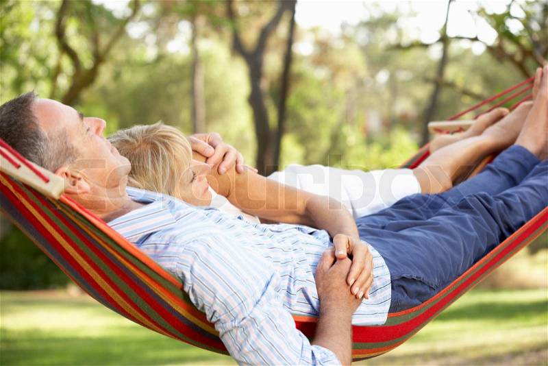 Senior Couple Relaxing In Hammock, stock photo