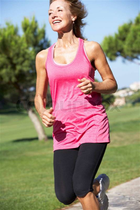 Senior Woman Exercising In Park, stock photo