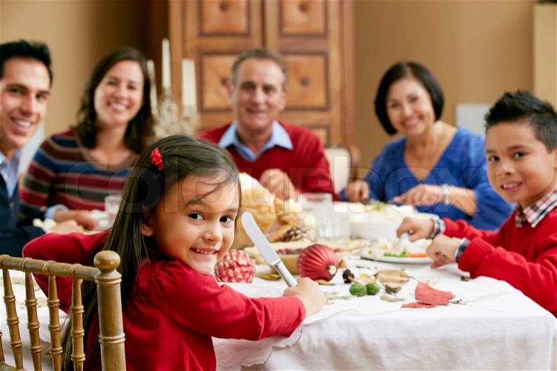 Multi Generation Family Celebrating With Christmas Meal, stock photo