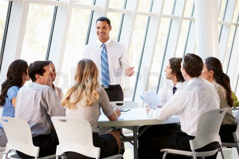 Business People Having Board Meeting In Modern Office, stock photo