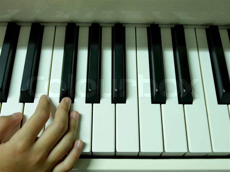 Finger Girl on the piano, stock photo