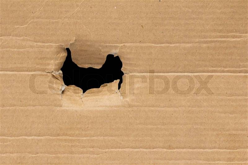 Black hole in a cardboard background, stock photo