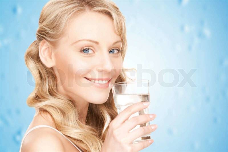 Closeup picture of woman hands holding glass of water , stock photo