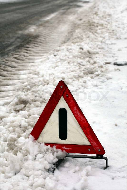 Accident. Warning triangle on winter road, stock photo