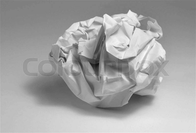 Crumpled paper ball in light grey back, stock photo