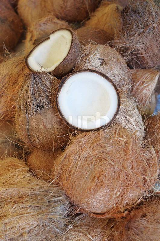 Opened Coconut shell on Coconut stack, stock photo