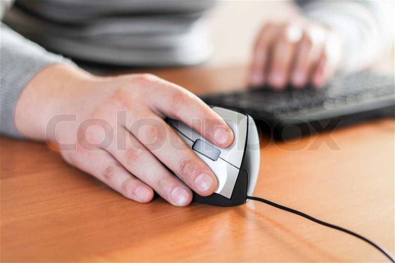 Close up man using keyboard and mouse, stock photo