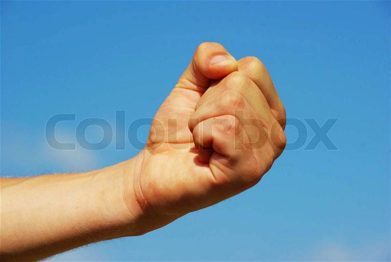 Clenched fist in the air, stock photo