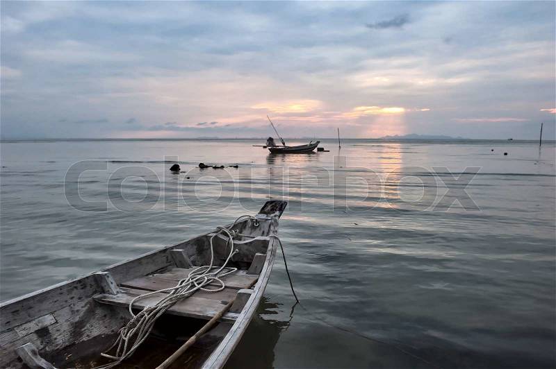 Sea boat art photography. Early morning ocean sunrise, stock photo