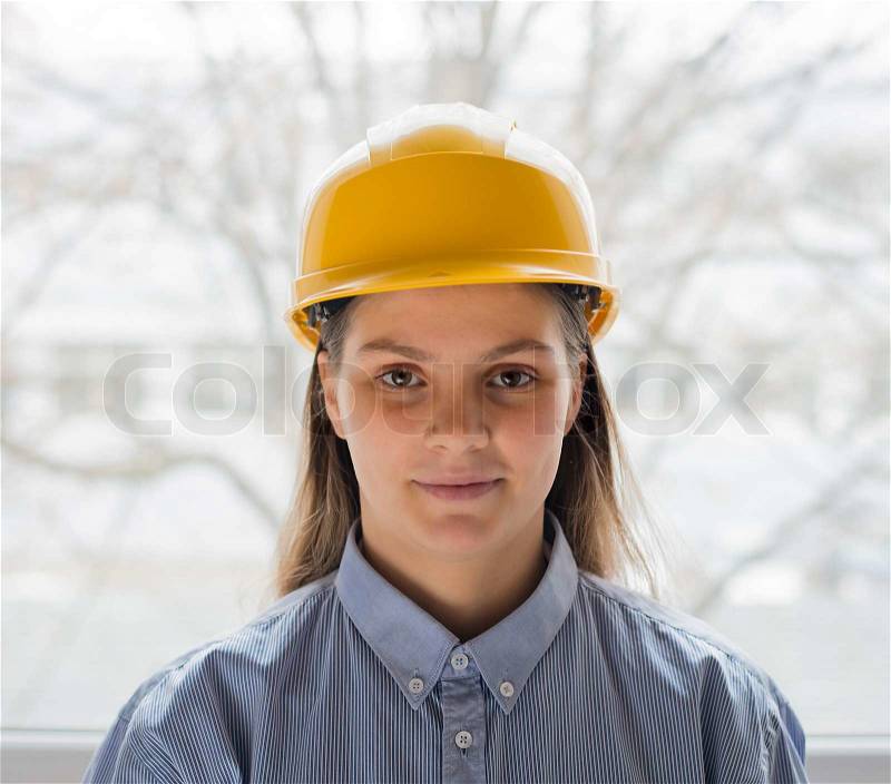 A woman in a helmet, stock photo