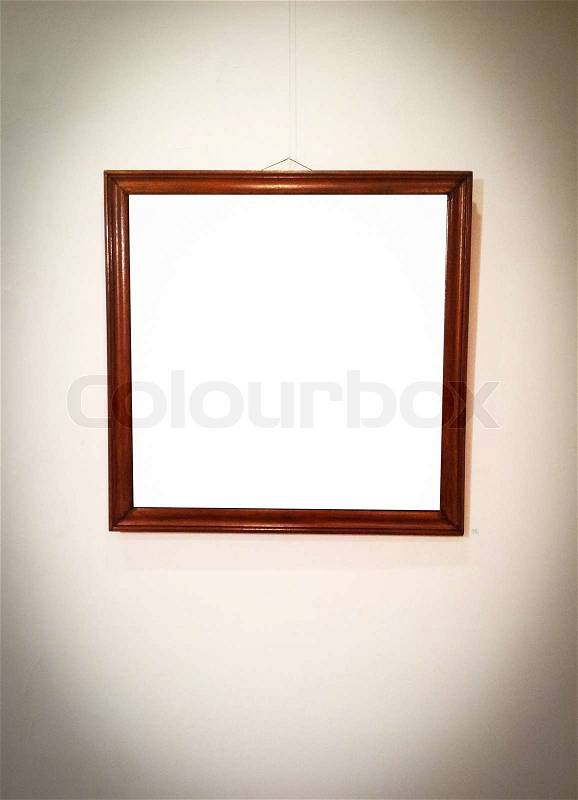 Empty picture frame on wall, stock photo