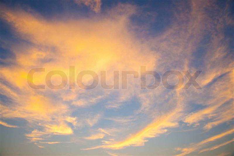 Sky in the evening. Clouds with evening sunlight near the orange. On Sky is blue, stock photo