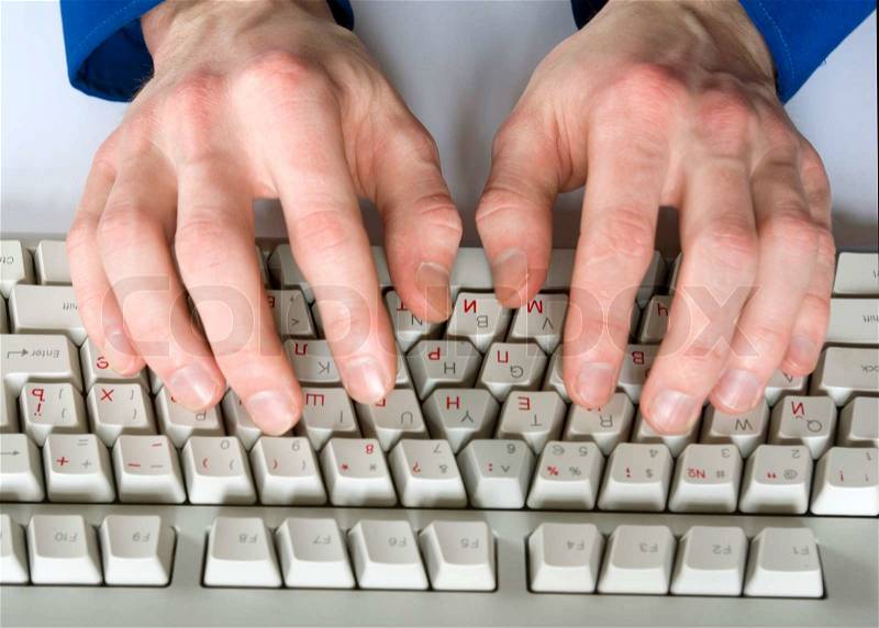 Fingers type a text on the computer keyboard, stock photo