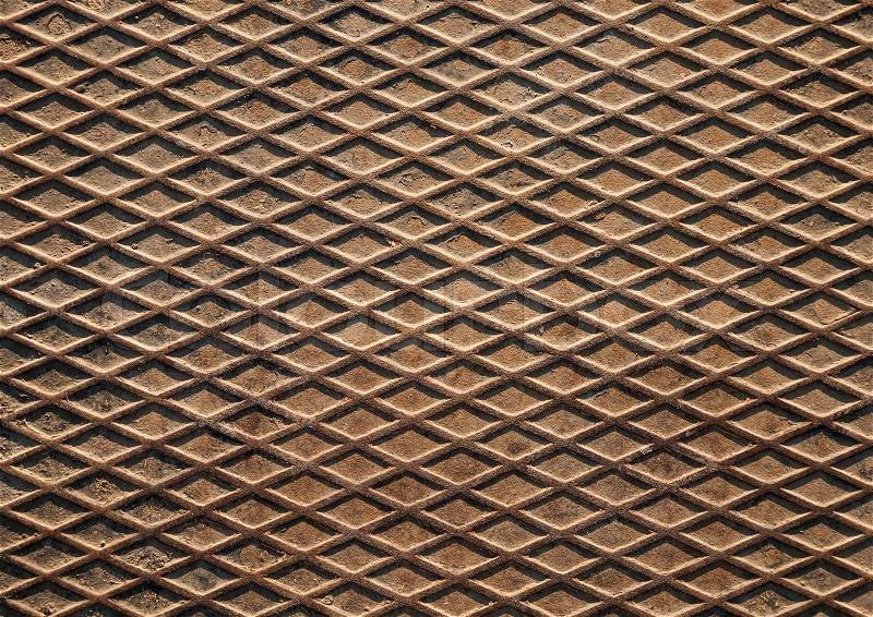 Rusted metal plate detailed grunge background texture with diamond pattern, stock photo