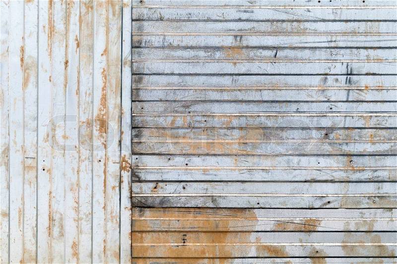 Old rusted corrugated galvanized metal wall background texture, stock photo