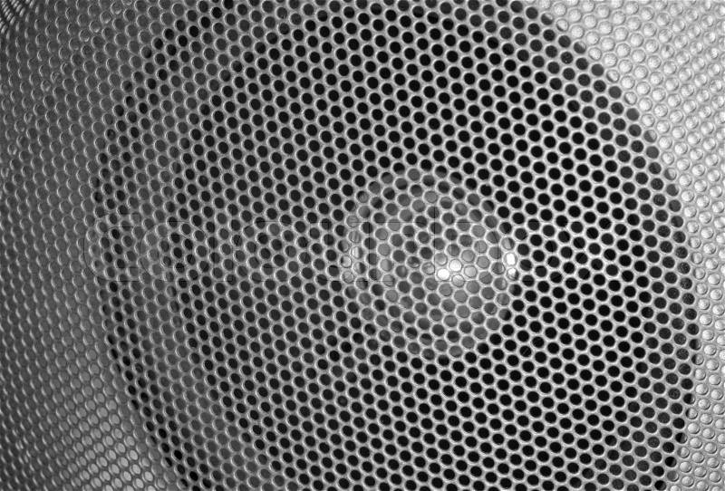 Full frame detail of a metallic grilled speaker, stock photo