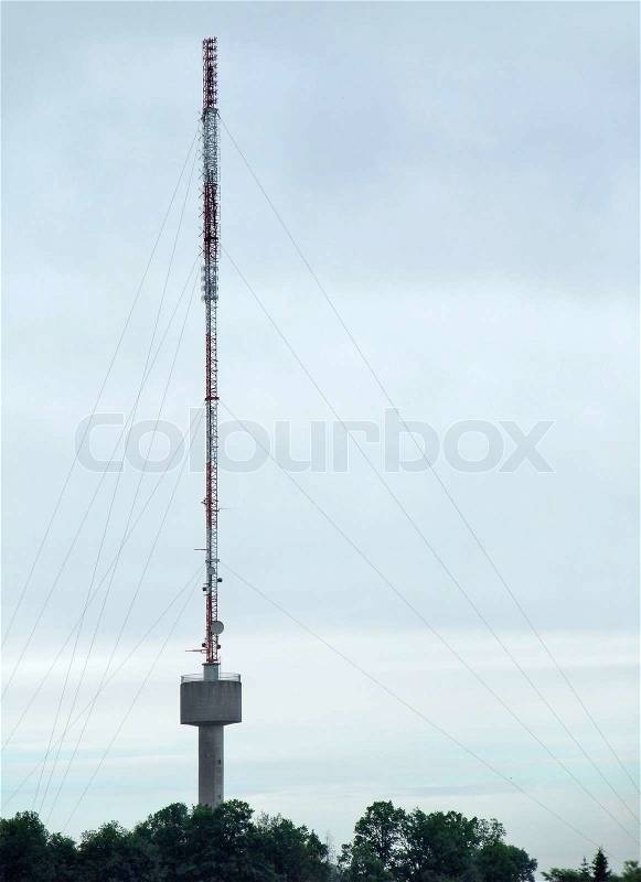 Radio tower in front of overcast sky, stock photo