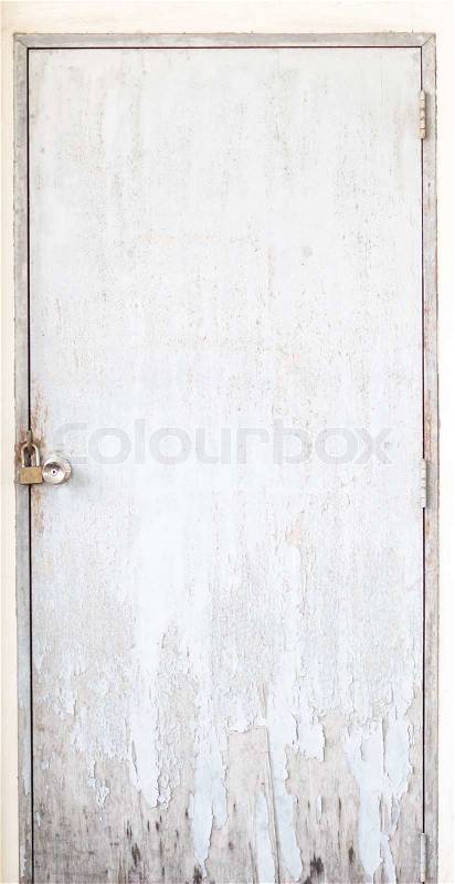 Old locked door on ruined wall, stock photo