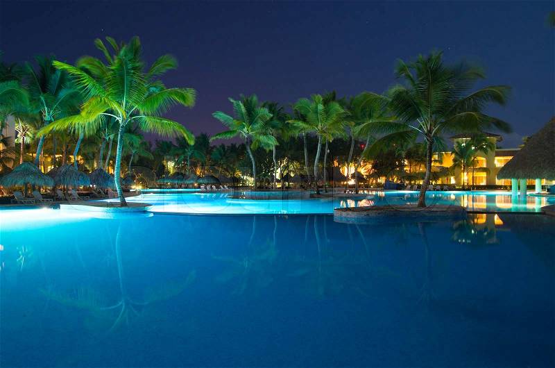 Swimming pool in night illumination, stock photo