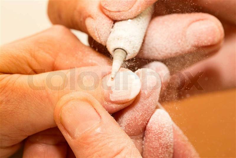 Processes work on a manicure in the salon, stock photo