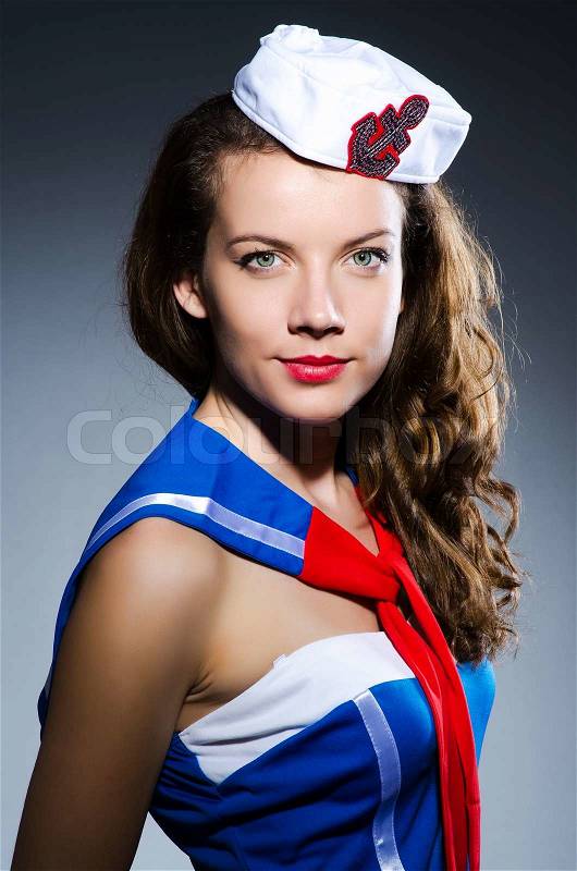 Young woman sailor in marine concept, stock photo
