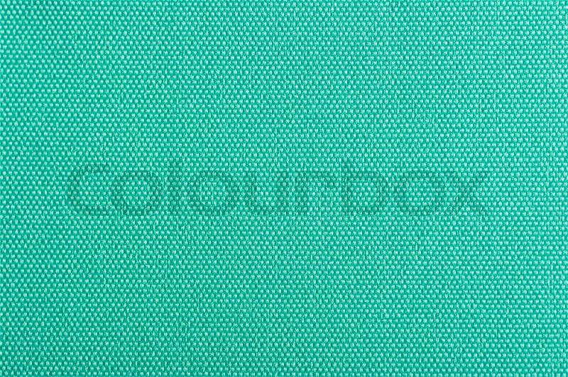 A close-up of turquoise fabric background texture, stock photo