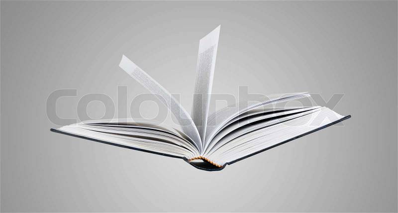 Flying book, stock photo